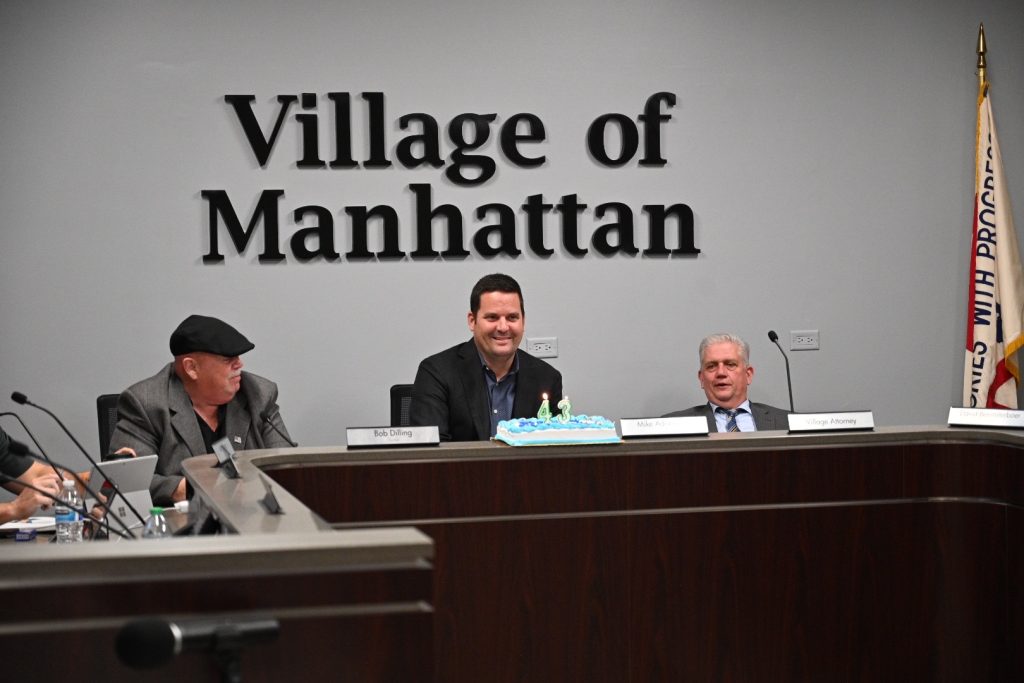 Manhattan Mayor Mike Adrieansen celebrated a birthday just before the Village board meeting on April 1. Photo by Stephanie Irvine.